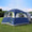 UNP SUV Tent for Camping 6-Person dark blue car camping tent with rainfly attached to SUV tailgate outdoors